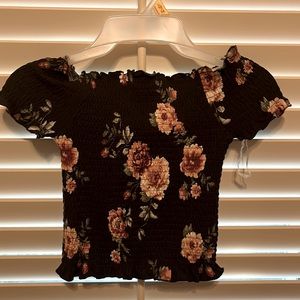 Size small with flowers in a black background